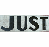 Vintage painted sign with enigmatic JUST AHEAD