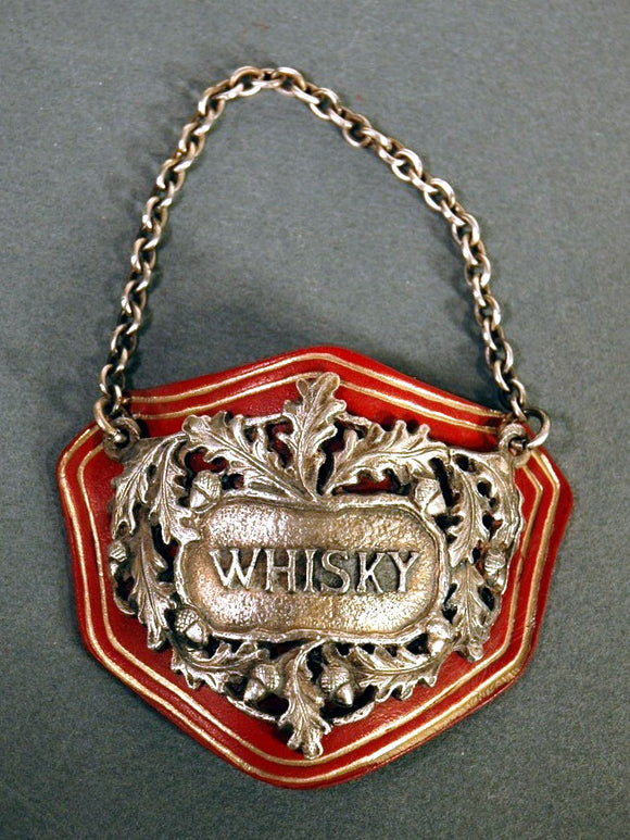 Vintage WHISKY label mounted on leaterh